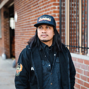 Glendale Harley-Davidson® Black Vintage Embers Trucker Hat Front Lifestyle 3